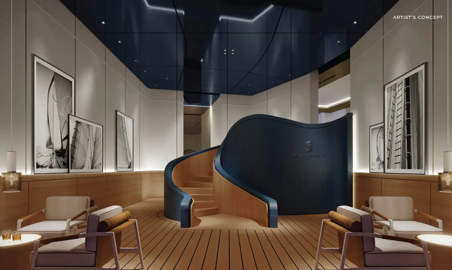 Interior detail of The Residences at Palm Beach Gardens showing the stretch ceiling continuing across the amenity-floor staircase under the Ritz-Carlton crest