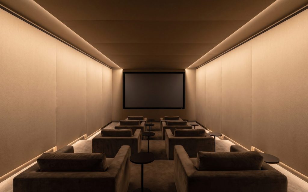 Acoustic stretch fabric walls running floor to ceiling in a screening room